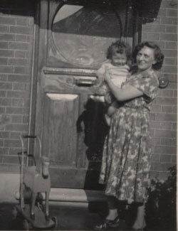 Aida Moslow Berglas holds son Harold in front of their home in London, England in 1951.